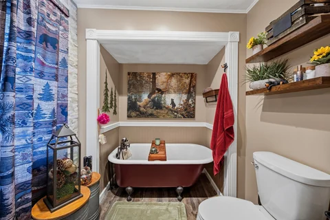 Bathroom with red clawfoot tub